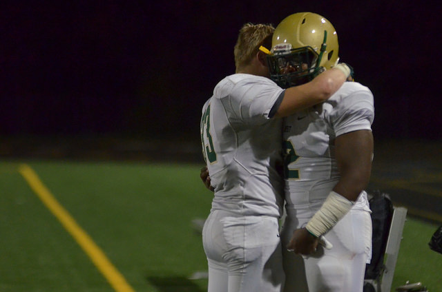 Max Brown `17 hugs senior player Yeshuwa Hicks `16 after the last game of the season against Bettendorf.