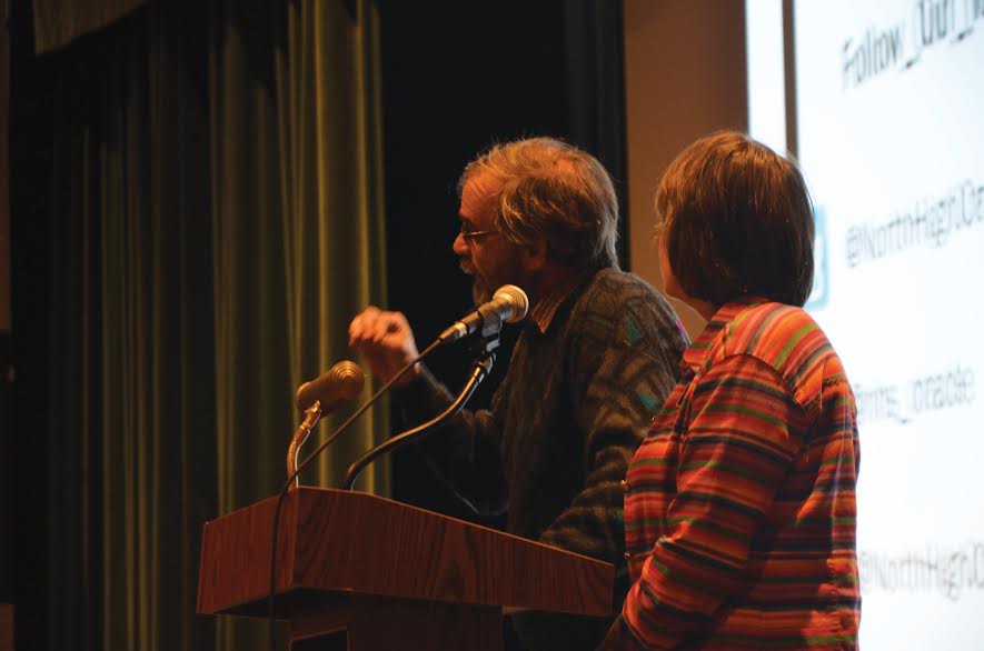 Mary Beth Tinker looks on to brother John Tinker during a presentation at Des Moines North High School this past Thursday, Dec. 16 to celebrate the 50th anniversary of his high school suspension that sparked the Supreme Court case Tinker v. Des Moines. 