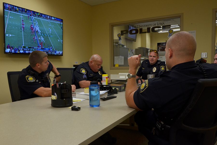 Roll call in the conference room included a pitcher of iced coffee to boost caffeine levels for late-night to early-morning shifts. 