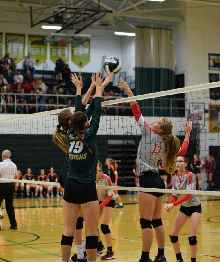 Ellie Kouba 19 sets the ball.