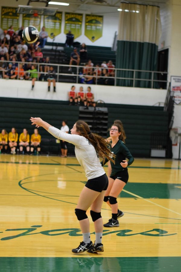 Laurel Kelley 19 bumps the volleyball.