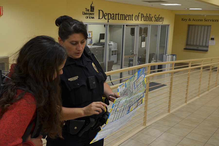 Outside of the public safety office, Officer Tristian outlines sectors on a map.