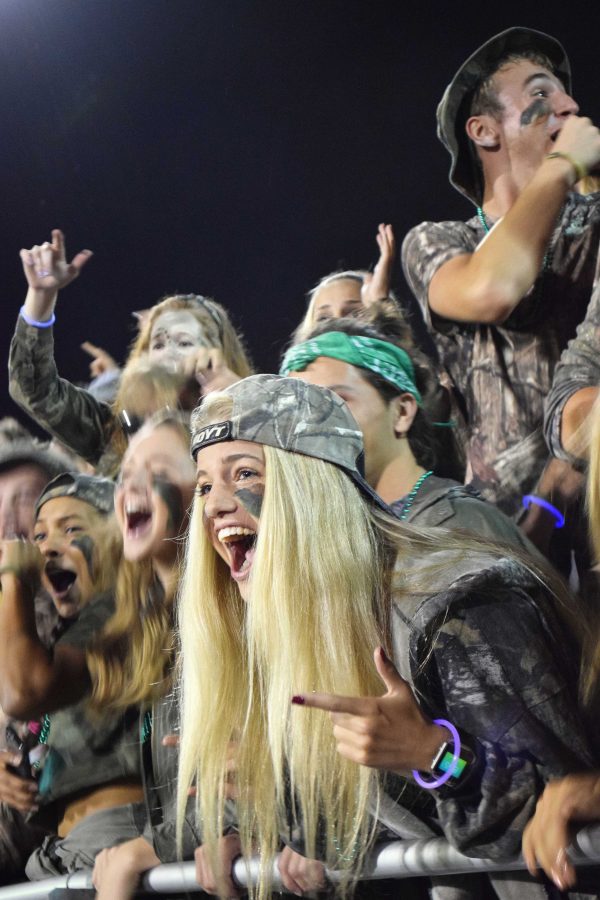 Regan Steigleder 17 cheers on with the rest of the West High student section.