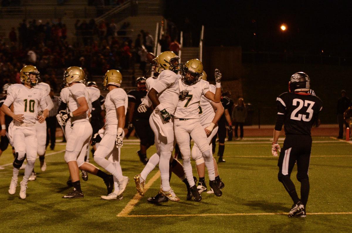 Traevis Buchanan `18 and Devontae Lane `17 celebrate one of Lane's touchdowns during their win against Lin-Mar on Oct. 14, 50-7.