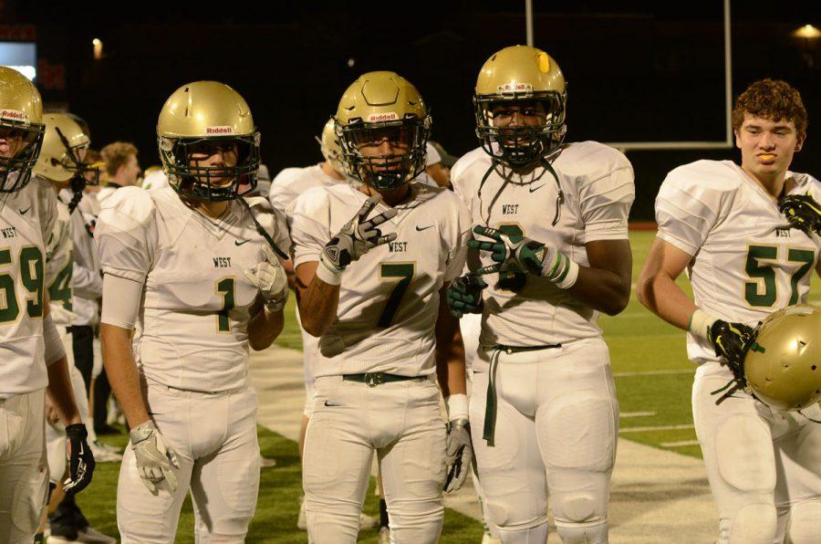 Andre White `18, Traevis Buchanan `18, and Devontae Lane `17 pose for a picture after beating Linn-Mar on Oct. 14, 50-7.