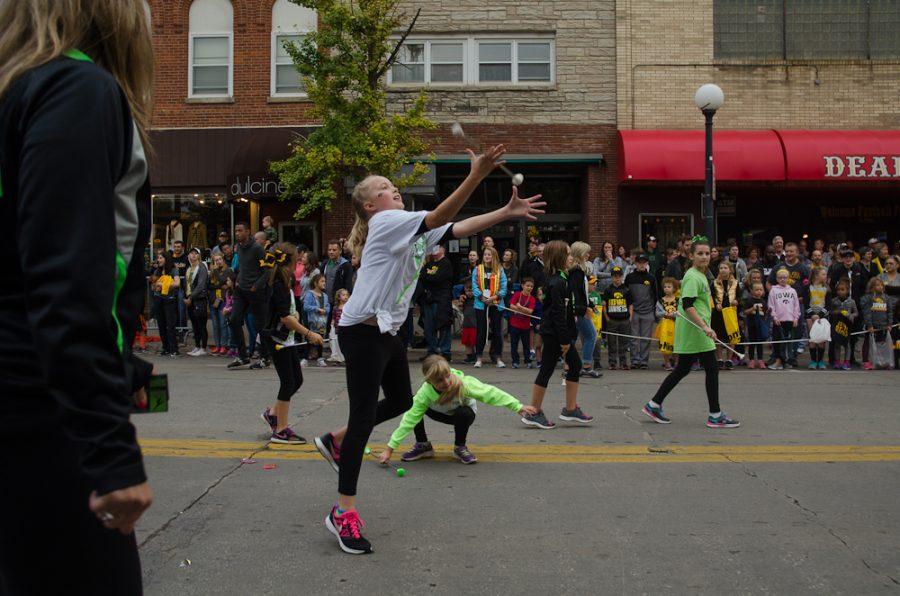 Young baton twirlers work their way through the parade.