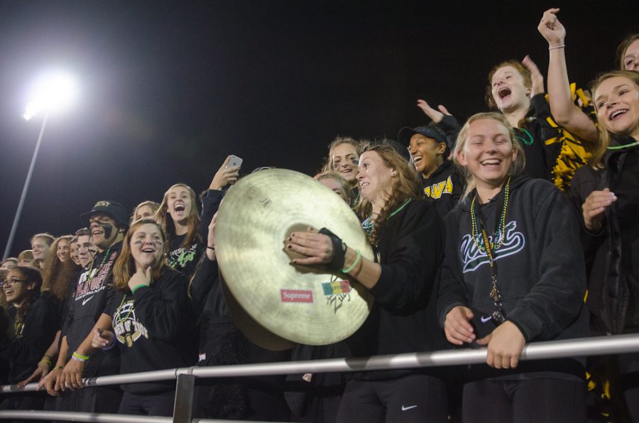 During the half time show, Madi Ford '17 solos with a cymbal. 