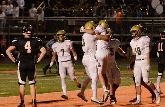 Austin West `18 and teammates celebrate the first touchdown of the game. West high beat Prairie, 38-14 to move onto the State Semifinals.