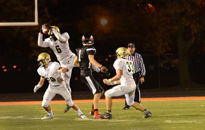 Devontae Lane `17 intercepts a ball during the West-Prairie game on Nov. 4. West high beat Prairie, 38-14 to move onto the State Semifinals.