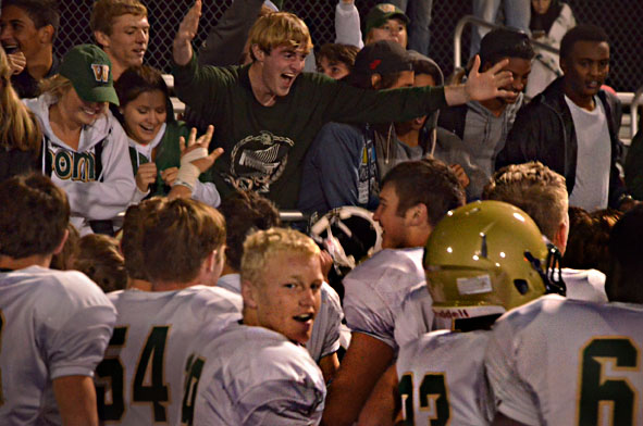 Players and fans celebrate after West high beat Prairie, 38-21 to move onto the state semifinals.