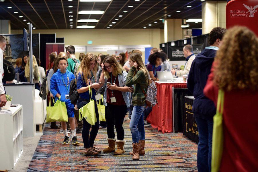 Three high school journalism students at the university fair in Griffin Exhibit Hall in the J.W. Marriott, Indianapolis, IN. 