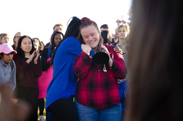 After sharing her experiences as a victim of harassment, Erin McCain '17 receives support from Isabele Miene '17.