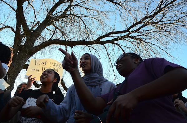 Luayn Hamad '18 and Shati Cooper '18 shout chants with the crowd.