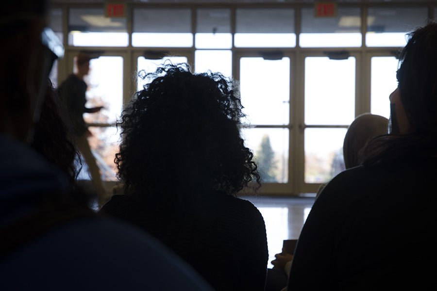 Wala Siddig '18 sits among friends to protest hate and discrimination.  