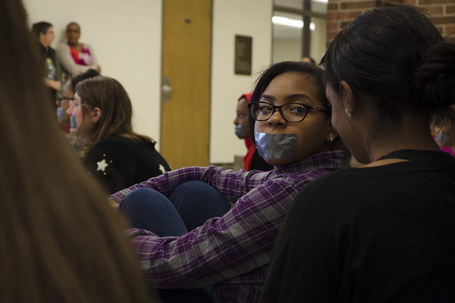 Tayshauna McGee '20 turns to face her friend in solidarity.