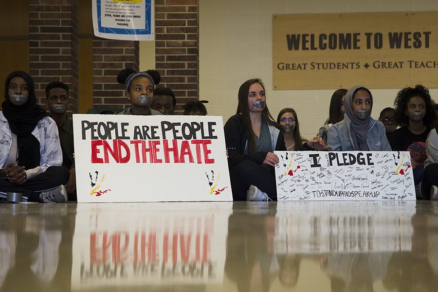 Jade Merriwether '17 displays a sign expressing her concerns for equality among people.