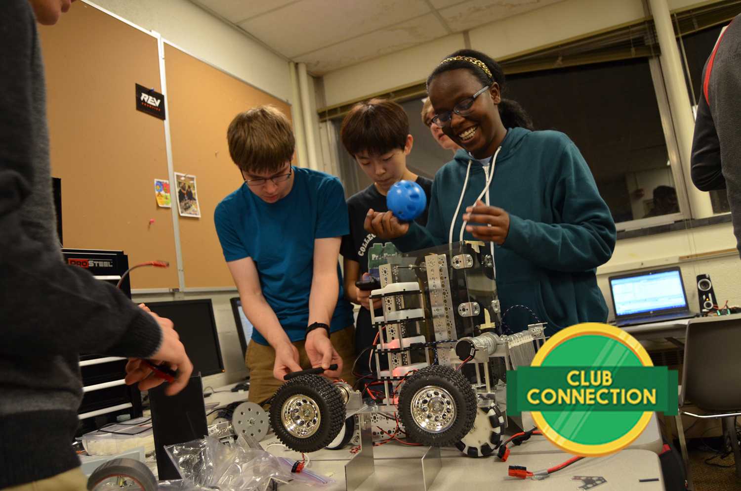 Yegor Kuznetsov '20, Jeongwoo Seo '18, and Eman Elsheikh '18 work on their robot's elevator on Tuesday at the Roosevelt education center. The elevator will carry the balls to the launcher