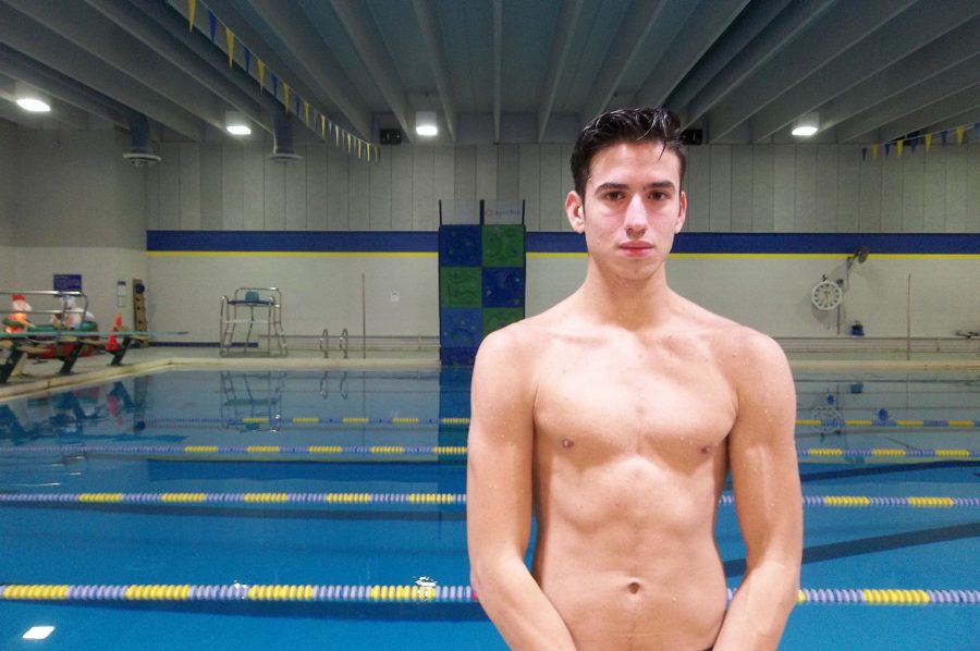 Naism Abu-Dagga 17 stands by the Coralville Recreation Center swimming pool after practice.  The No. 9  ranked Trojans faced No. 10 Cedar Rapids Washington on Tuesday, Jan. 10.