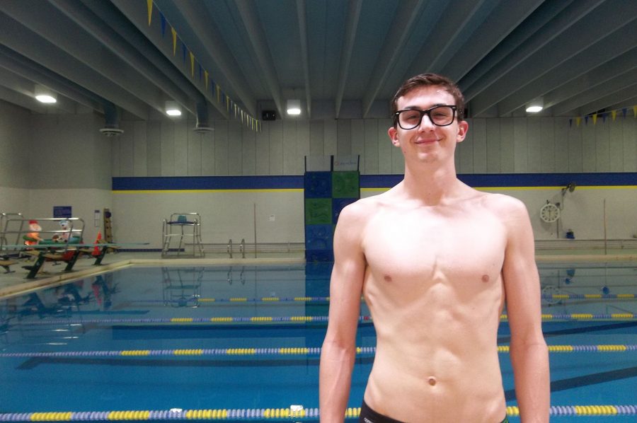 Sam Deyak 17 stands by the Coralville Recreation Center swimming pool after practice.  The No. 9 ranked Trojans faced No. 10 Cedar Rapids Washington on Tuesday, Jan. 10.