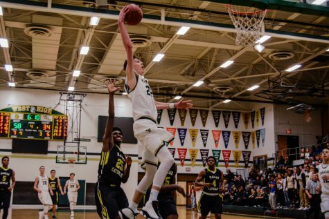 Trojan basketball wins big at first home game