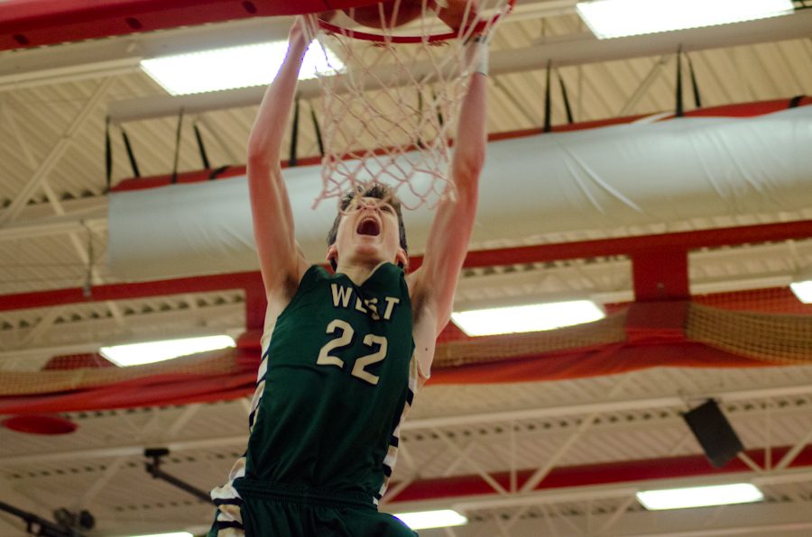 Patrick McCaffery '19 dunks a second basket in the first half of the game against City High School. In the third quarter Patrick will make a third dunk, an alley-oop with assist from Izaya Ono-Fullard '17 bringing the game to 74-32.