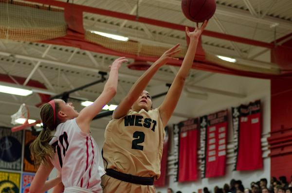 Cailyn Morgan '19 goes for a layup at the buzzer after a toss up at the end of the second quarter leaving West in the lead at 32-27.