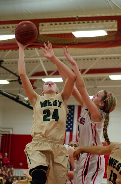 Emma Koch '19 reaches for a layup in the second half of the game.