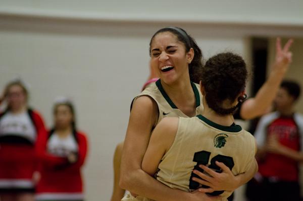 Cailyn Morgan '19 jumps into the arms of Rachel Saunders '18 after teammate Logan Cook '18 is fouled and seals the win for West against City at 63-58.