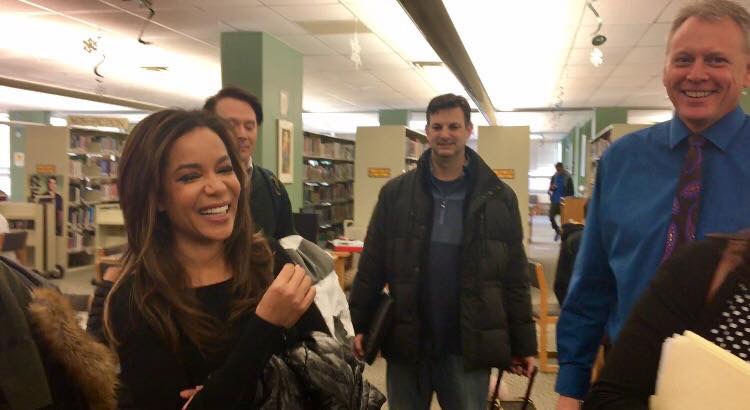 The View reporters Sunny Hostin and Clay Aiken talk with producers and Principal Gregg Shoultz after conducting student interviews in West Highs library before school Jan. 6.
