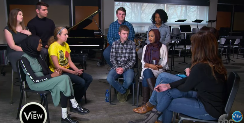 The students sit in together in the North band room during a panel discussion held by The View. The View came to West on Jan. 6.