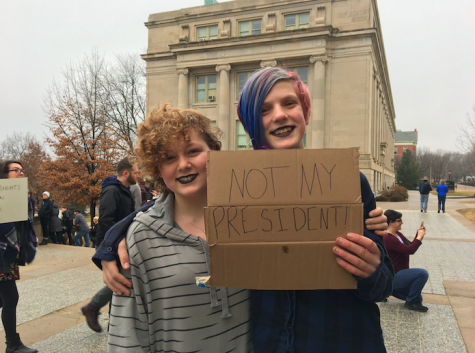 Junior high students Maddie and Lucy hold a sign to show whats on their minds.