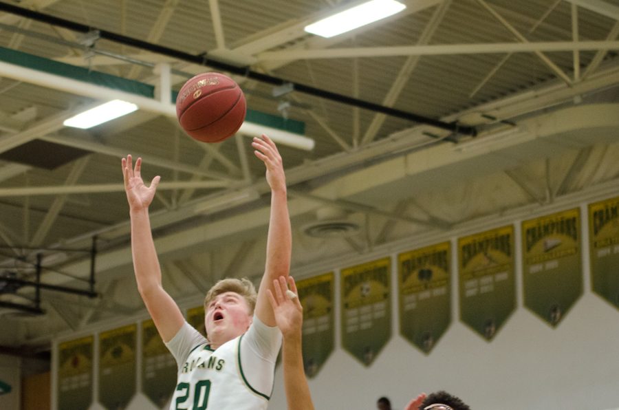 In the fourth quarter, Nate Disterhoft'17  reaches for a pass with Seybian Sims'18 at his side. Disterhoft will make an assist to Devontae Lane'17 for two points. 