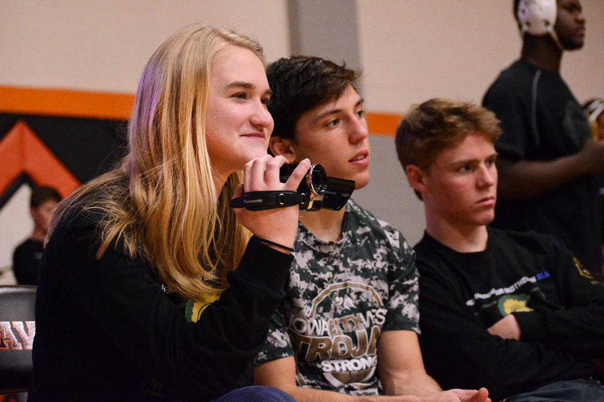 As part of her duties as a manager for the West Wrestling team, Laurel Haverkamp '20 records a match during the West vs. Cedar Rapids Prairie meet on Feb. 2, 2017.