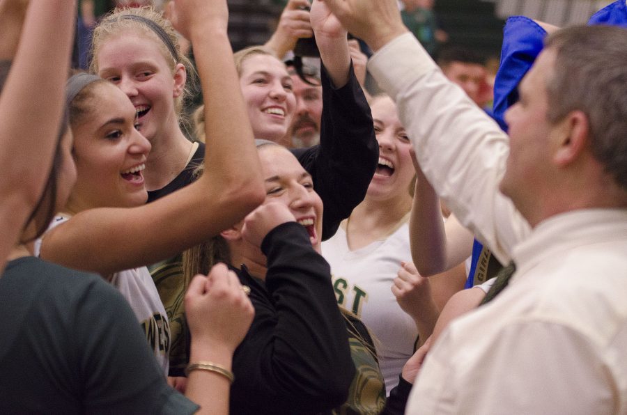 West+High+girls+celebrate+with+Coach+Meyer+after+their+substate+win.