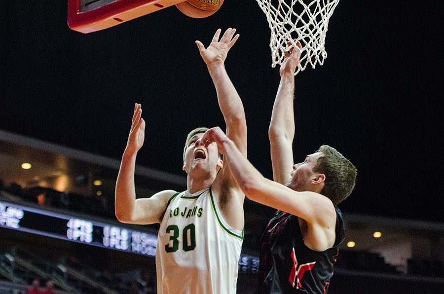 Connor McCaffery '17 reaches for a layup in the first half of the 4a state quarterfinals against Newton High School at Wells Fargo Arena on Wednesday Mar. 8.