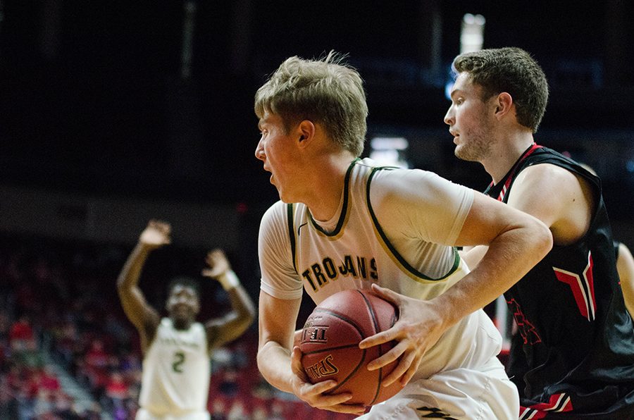 Nate Disterhoft17 looks to Devontae Lane 17 for a pass in the first half of the game against Newton High School in the 4a state quarterfinals at Wells Fargo Arena on Wednesday Mar. 8. 