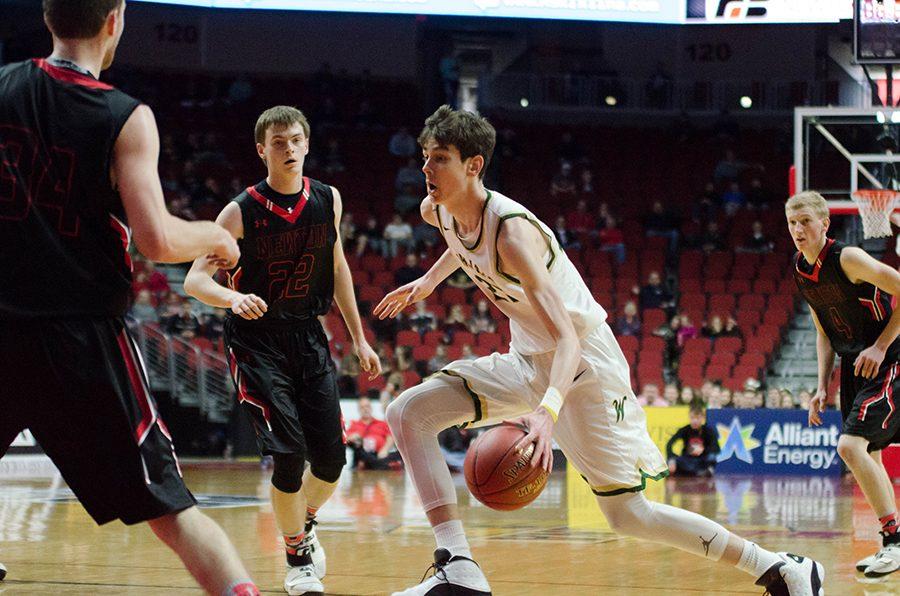 Patrick McCaffery '19 drives into Newton's defense in the first half of the 4a state quarterfinals. McCaffery will later foul out at the end of the first quarter. 