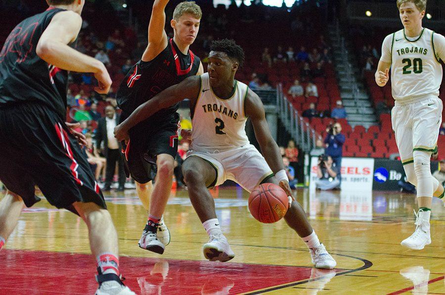 On the offensive, Devontae Lane 17 drives past Newtons defense in the second half of the 4a state quarterfinals at Wells Fargo Arena, Wednesday Mar. 8.