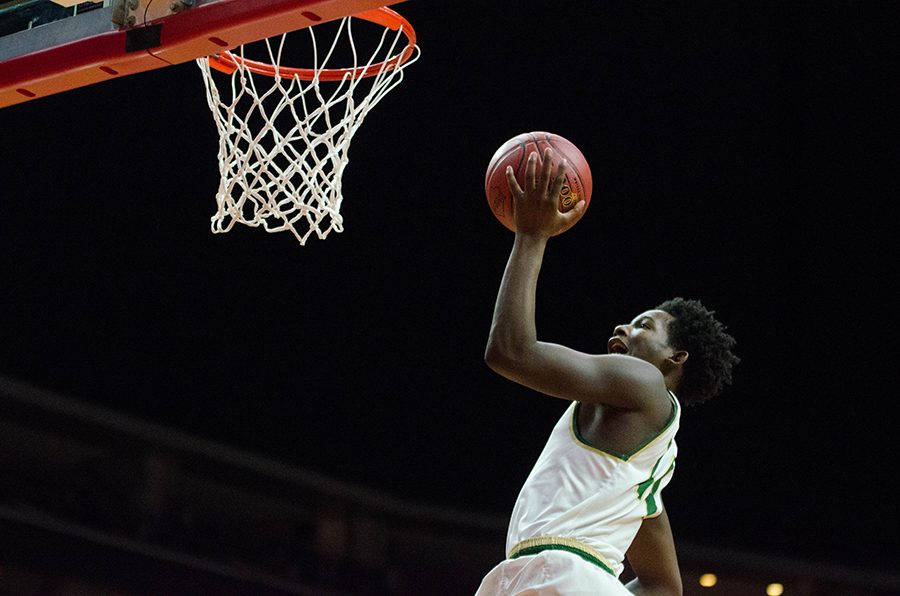 After stealing the ball from Newtons Josh Ventling 17, Hakeem Odunsi 18 reaches for a layup but misses due to a foul. Odunsi will make one shot out of two making the game 36-35 in the third quarter.