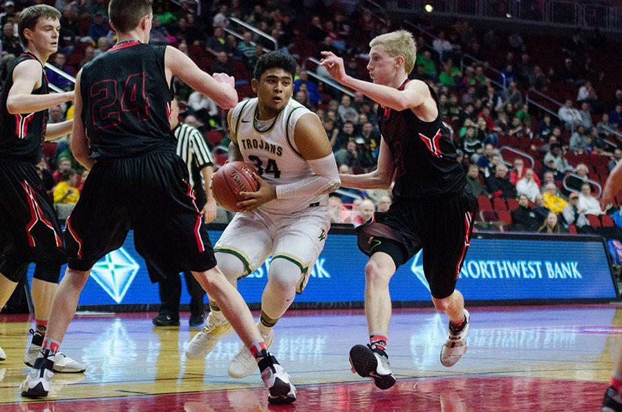 In the second half, Izaya Ono Fullard 17 weaves his way through Newtons defense in the 4a state quarterfinals at Wells Fargo Arena, Wednesday Mar. 8.