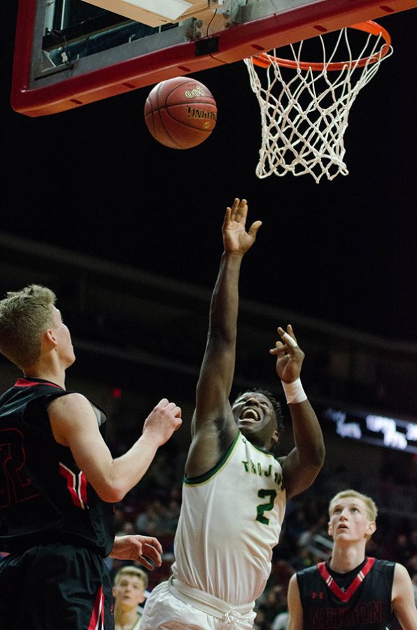 Devontae Lane '17 misses a layup, but is able to recover it with a rebound and make the shot in the last fifteen seconds of the third quarter, tying the game 43-43 against Newton High School. 