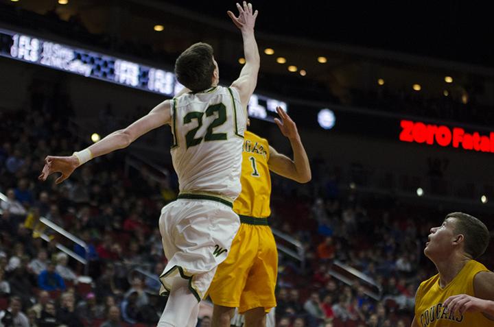 Patrick McCaffery 19 goes for the ball against Kennedys Malik Haynes17 in the 4a state semifinals at Wells Fargo Arena on Friday Mar. 10. 