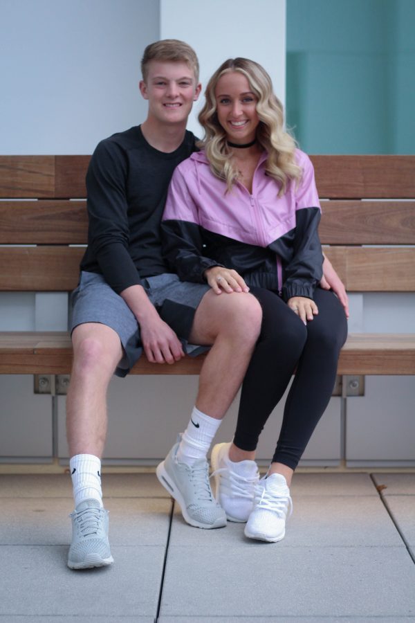 Natalie Roetlin 18 and Evan Flitz 18 pose together at the Voxman Music Building in their sporty outfit. 