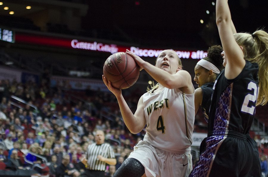 Lauren Zacharias '19 goes for a layup in the first half of the girls state quarter finals against Waukee. 