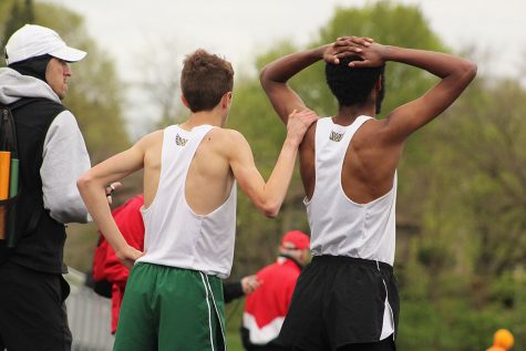 Kolby Greiner 19 and Ali Ali 17 confront each other after the 3,200 meter run. 