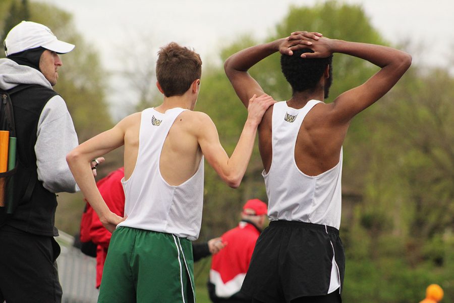 Kolby Greiner '19 and Ali Ali '17 confront each other after the 3,200 meter run. 