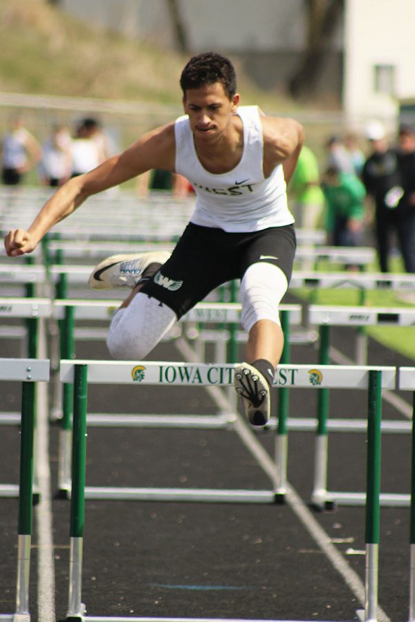 Javonte Williams '17 passes over the last hurdle during the shuttle hurdle relay; West placed second. 