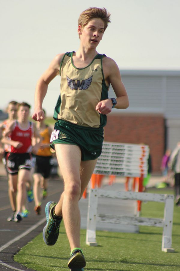 Micah Bailey '18 runs in the 3200 meter run where he placed 14th. 