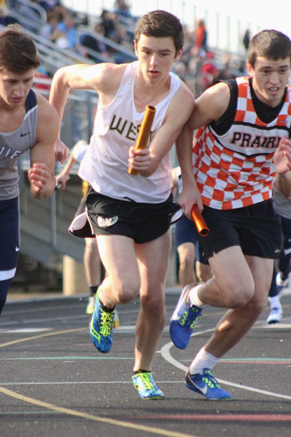 Andrew  Rompot '17 battles against a runner form Prairie to get in front. 