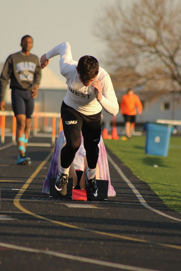 Trevor Byers '18 sprints off the blocks for his 200 meter race where he finished 17th. 